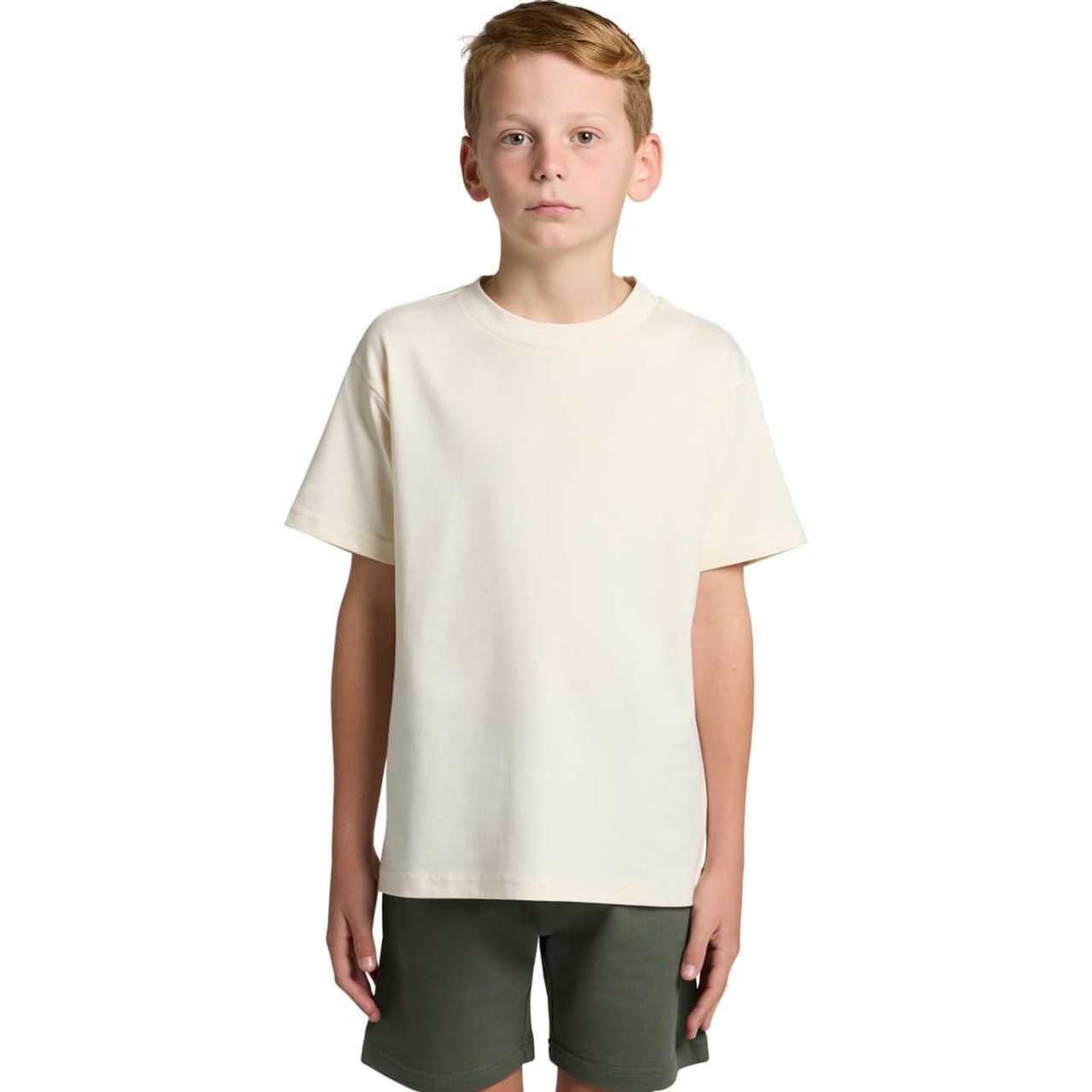 A plain cream youth classic tee with short sleeves, paired with dark green shorts. Features a logo on the tee.