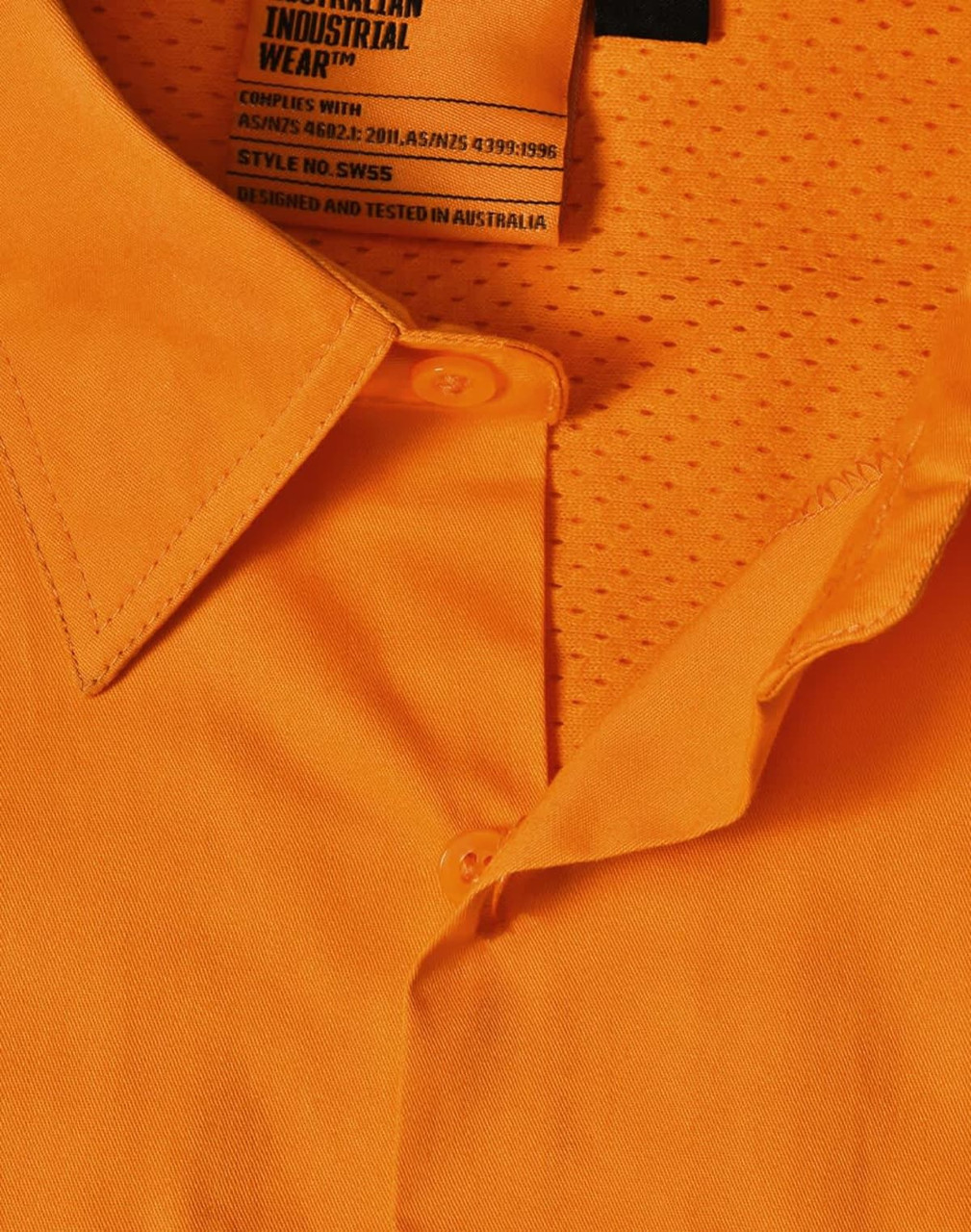An orange safety shirt featuring a collar and mesh detailing, with a tag indicating industrial wear.