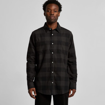 A black check shirt with a button-up front and long sleeves, featuring a logo on the chest pocket.