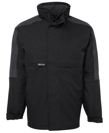 A black and charcoal rain jacket featuring a high collar and elastic cuffs, with a logo on the front.