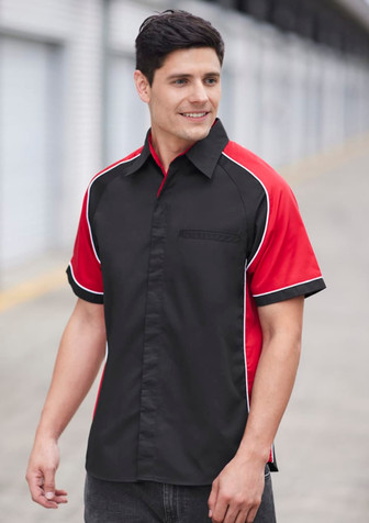 A men's short sleeve button-up shirt in black and red, featuring a contrasting design and pocket.
