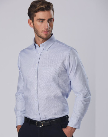 A long sleeve button-up shirt in light blue with a dot contrast pattern and a single chest pocket, featuring a logo.