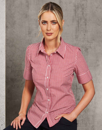A fitted women's short-sleeve button-up shirt in red and white gingham check pattern, featuring a logo.