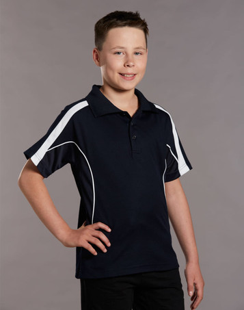 A young boy wearing a navy blue polo shirt with white accents and a logo. The shirt has a classic collar and short sleeves.