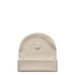 A beige cuff beanie with a folded brim and a seamless design. It features a branding logo.