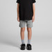 Youth stadium shorts in grey, featuring an elastic waistband, paired with black sneakers and grey socks.