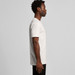 A white organic t-shirt displayed on a model in profile view, showcasing its simple design and fit.