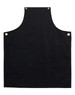 A black canvas bib apron featuring a front pocket and brass eyelets. It has a simple, sleek design.