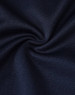 A close-up of navy fabric, showcasing a smooth texture with a slight sheen, ideal for shirts.