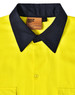 A Hi-Vis long sleeve safety shirt in bright yellow with a dark navy collar, featuring a label and button closures.