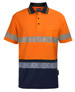 High-visibility polo shirt in orange and navy, featuring reflective segmented tape and a pocket. Brand logo present.