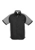A black and grey short sleeve button-up shirt with a logo on the chest and contrasting panel details.