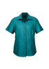A short-sleeve button-up shirt in teal with a collar and a front button placket. It features a logo.