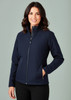A navy blue soft shell jacket for women, featuring a full zip and side pockets, with a model showcasing it.