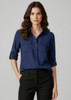 A navy button-up long sleeve shirt with two front pockets, styled with rolled sleeves and a neat collar.
