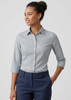 A women's button-up shirt with a checked pattern, featuring 3/4 sleeves and a collar, in shades of grey and white.