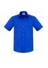 A blue short sleeve button-up shirt with a chest pocket and a logo on the label.
