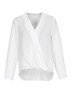 A white hi-lo blouse with a wrap design and long sleeves, featuring a subtle logo on the tag.
