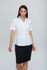 A short-sleeve button-up shirt in white, paired with a black skirt, featuring a logo.