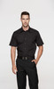 A short-sleeve black button-up shirt on a model, paired with dark trousers, featuring a subtle logo.