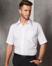 A short-sleeve white button-up business shirt with a pocket, worn by a male model against a grey backdrop.