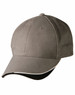 A khaki cap with a curved peak, featuring a simple design and an interior black lining. It has a logo on the front.