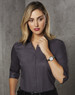 A grey, button-up shirt with 3/4 sleeves, featuring a sleek design and a slight sheen, worn with a wristwatch.