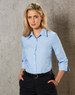 A button-up women's shirt in light blue with pinstripes and 3/4 sleeves, featuring a collar and a fitted design.