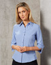 A light blue women's 3/4 sleeve shirt with a collared neckline and button-up front, featuring a subtle logo.
