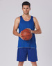 A model in blue basketball shorts and a matching tank top holds a basketball. The outfit has a logo present.