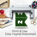 Plant-themed classroom bunting pages printing from a home printer on a teacher desk with books, apple, scissors, pens, and glasses. The printable banners feature dark green centers, white letters, and leafy borders. Text reads “Print & Use, Easy Digital Download,” showing how the classroom decor can be printed, cut, and displayed quickly for bulletin boards or wall decor.