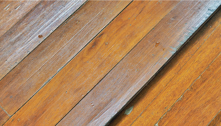 Why do my wood floors buckle and cup in the summertime?