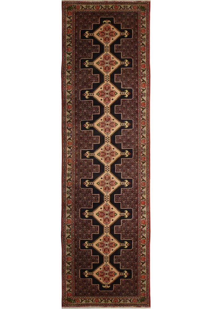 A close-up of a Persian Senneh runner featuring a geometric pattern in shades of blue, red, and ivory. A close-up of a Persian Senneh runner featuring a geometric pattern in shades of blue, red, and ivory.