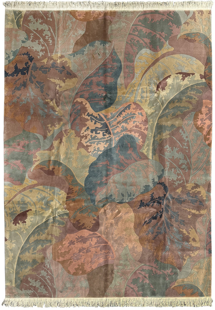 A detailed view of a 9x12 Modern Art Deco Beijing rug showcasing an organic pattern of overlapping autumnal leaves in earthy tones with a soft fringe edge A detailed view of a 9x12 Modern Art Deco Beijing rug showcasing an organic pattern of overlapping autumnal leaves in earthy tones with a soft fringe edge