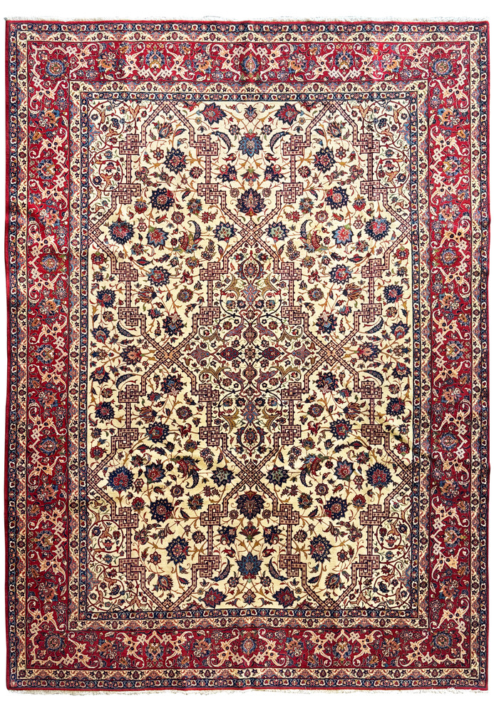 Full view of a 11x15 Persian Isfahan wool and silk rug with intricate patterns on an ivory field and deep red borders. Full view of a 11x15 Persian Isfahan wool and silk rug with intricate patterns on an ivory field and deep red borders.