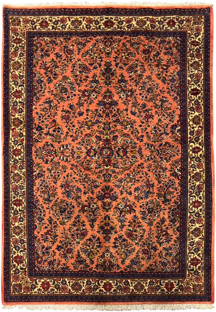 Full view of a 5'6" x 8'5" Persian Sarouk rug with intricate floral design. Full view of a 5'6" x 8'5" Persian Sarouk rug with intricate floral design.