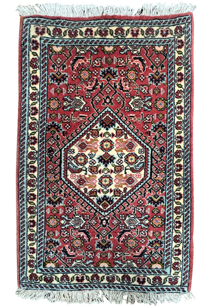Full view of 1'6 x 2'2 Bijar Poshti Persian rug with red field, ivory medallion, and floral motifs handwoven in Bijar, Iran