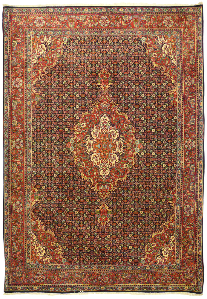 Full view of 6'9 x 9'8 Persian Bijar rug with navy field and red medallion