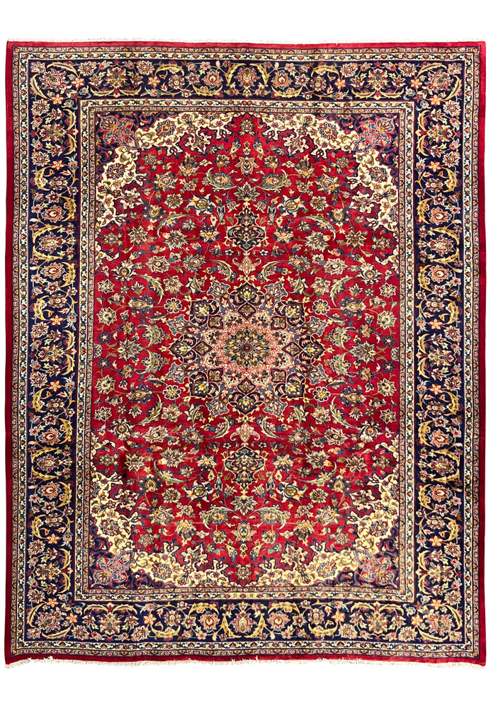 Full view of 9'6 x 12 Persian Isfahan rug with red field and navy floral border