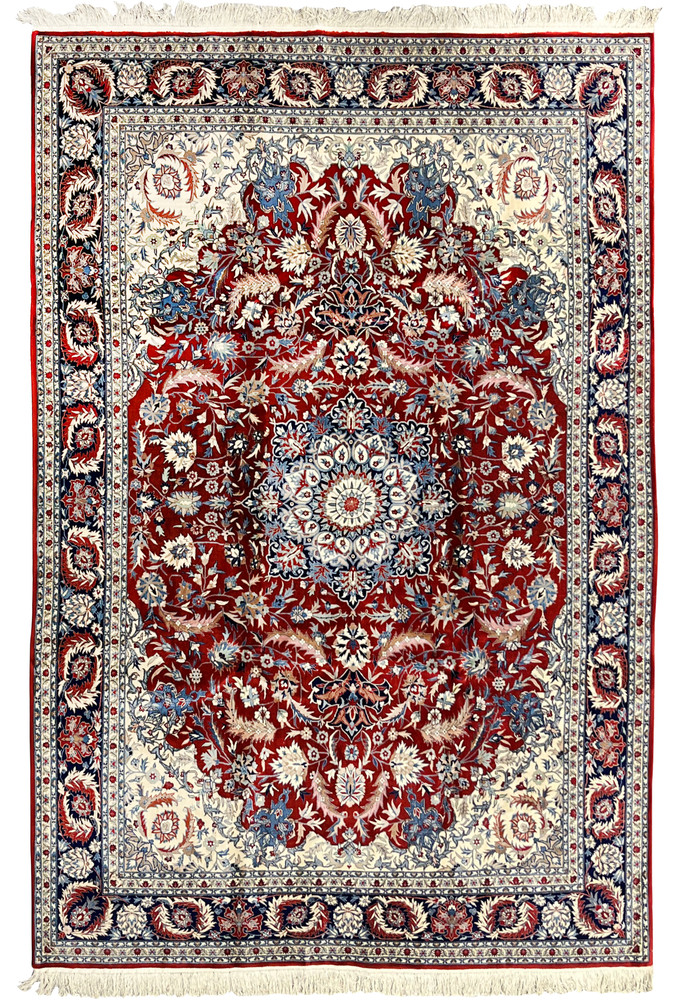 Full view of an 8'5 x 11'8 Persian Isfahan rug featuring a rich red floral field, detailed central medallion, and ivory framed border