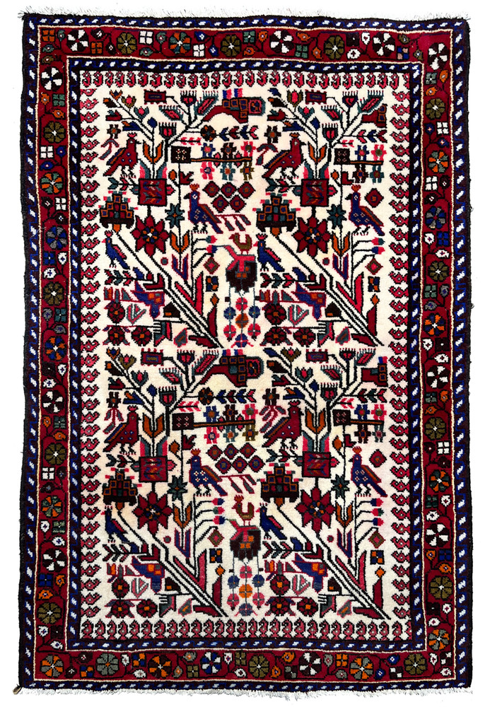 Hand-knotted 3'5 x 5 Persian Rudbar village rug with allover tree and bird design, ivory field, deep red border, and rich tribal wool craftsmanship.
