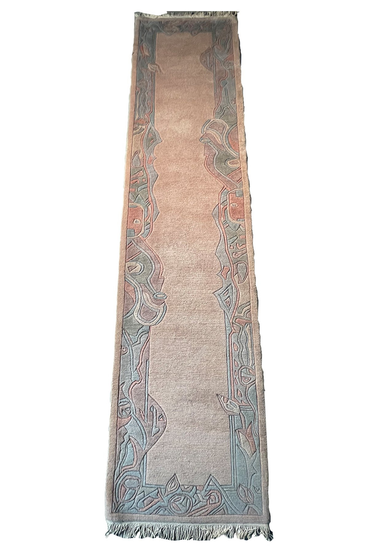 The Modern Nepali Runner Rug laid out, highlighting its long, narrow shape
