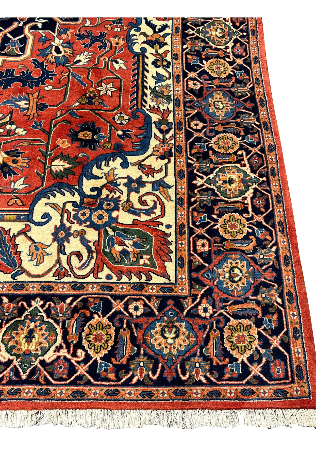 Wide border detail of a Persian Heriz rug featuring navy ground, repeating rosettes, and geometric lattice pattern