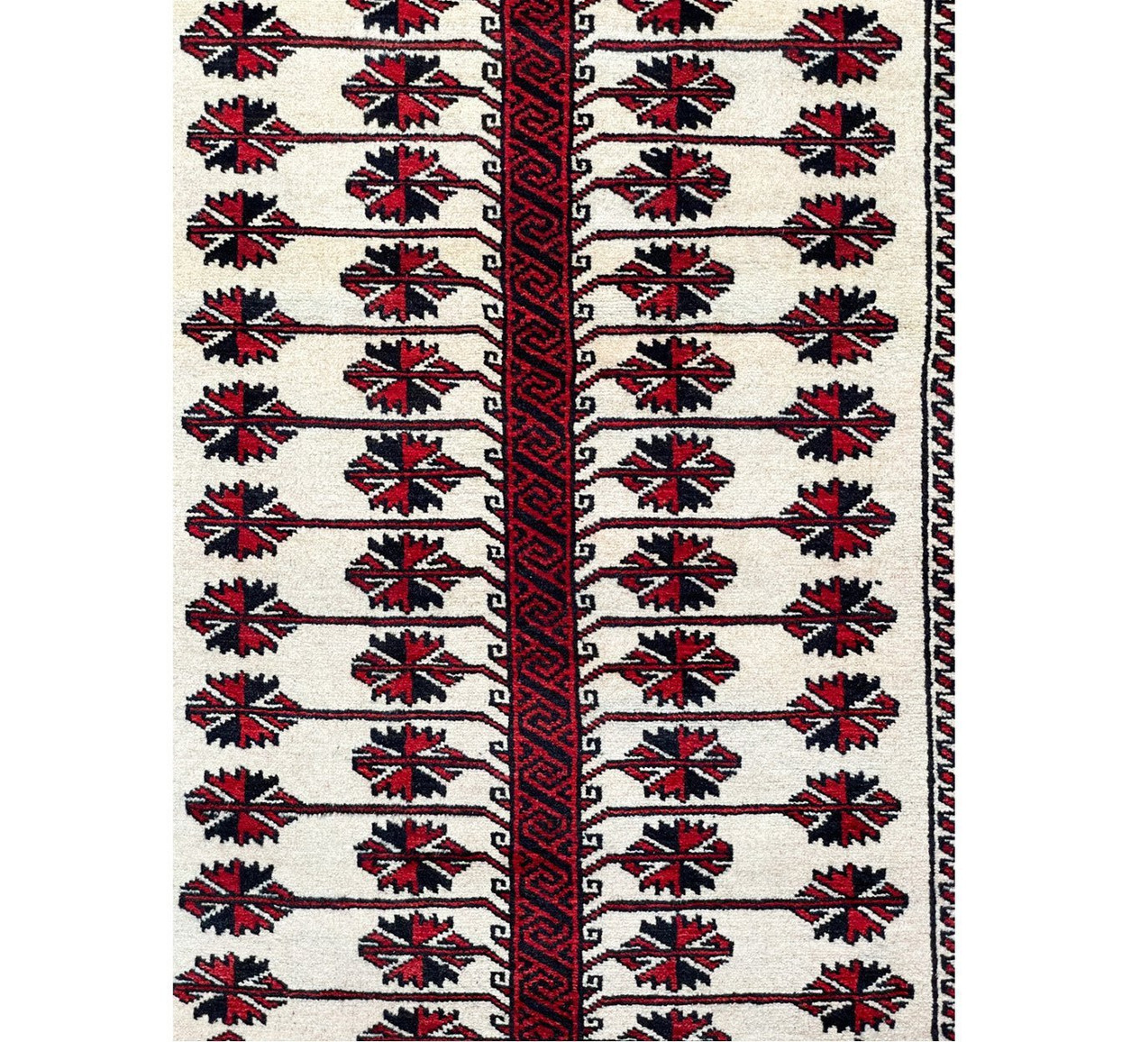 Intricate details of the Persian Baluch rug captured in a close-up shot, highlighting the unique beauty of its design