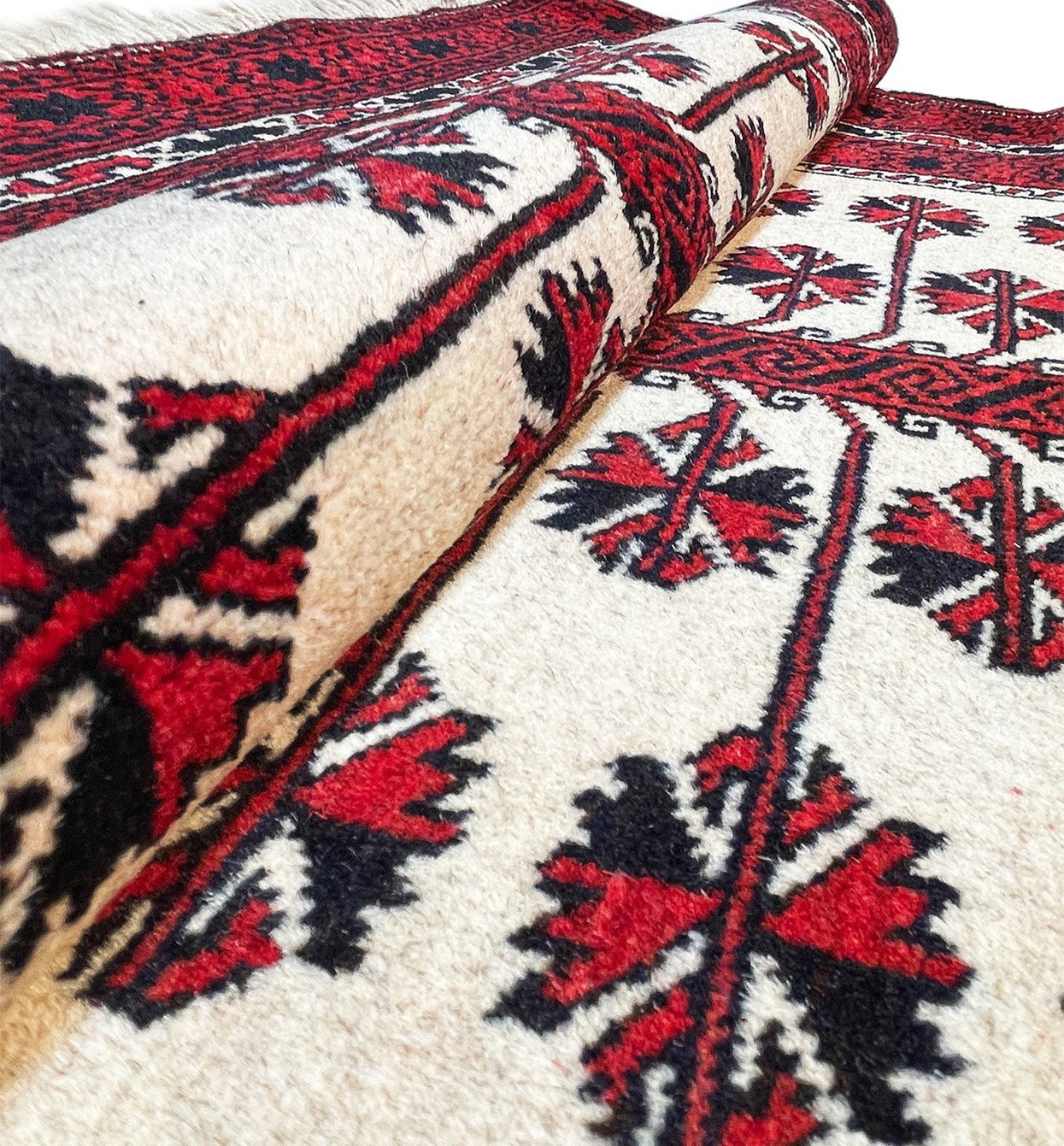 Close-up of the high-quality wool used to create the Persian Baluch rug, showcasing its fine texture and durability.