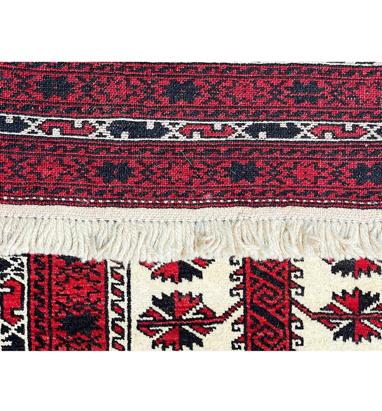 The back of the Persian Baluch rug, showcasing the high-quality craftsmanship and attention to detail