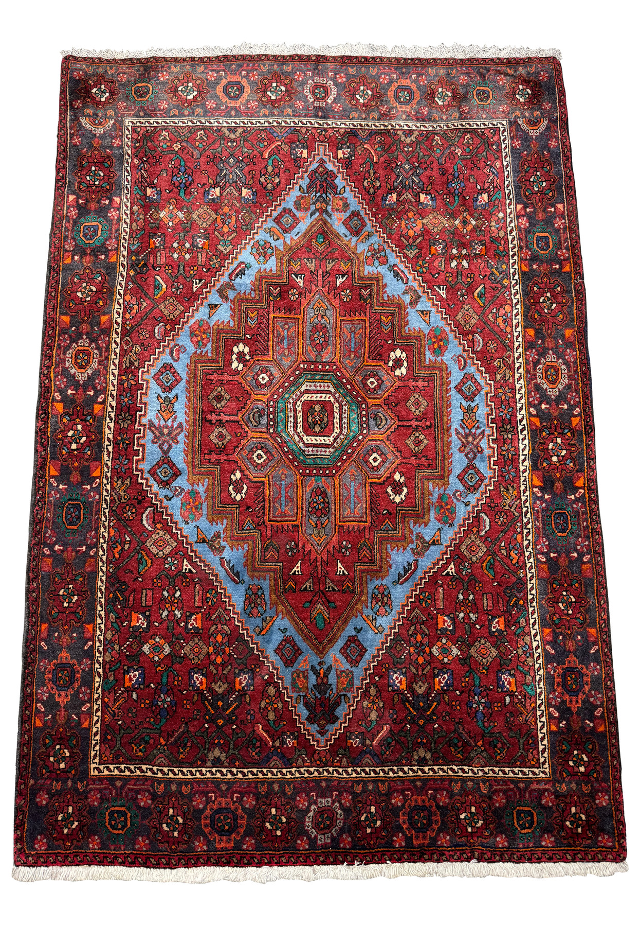 Perspective view of a Persian Gholtogh Rug, showing the detailed patterns that extend across its entire surface