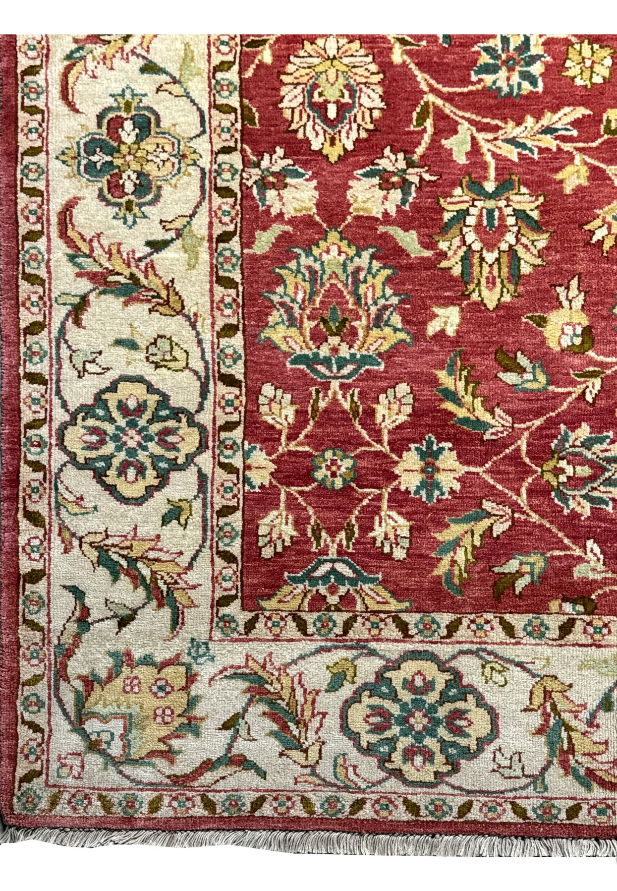 Corner detail of a 6x9 Ziegler Rug, emphasizing the delicate floral border design on a beige background, characteristic of a handmade oriental rug's sophisticated style