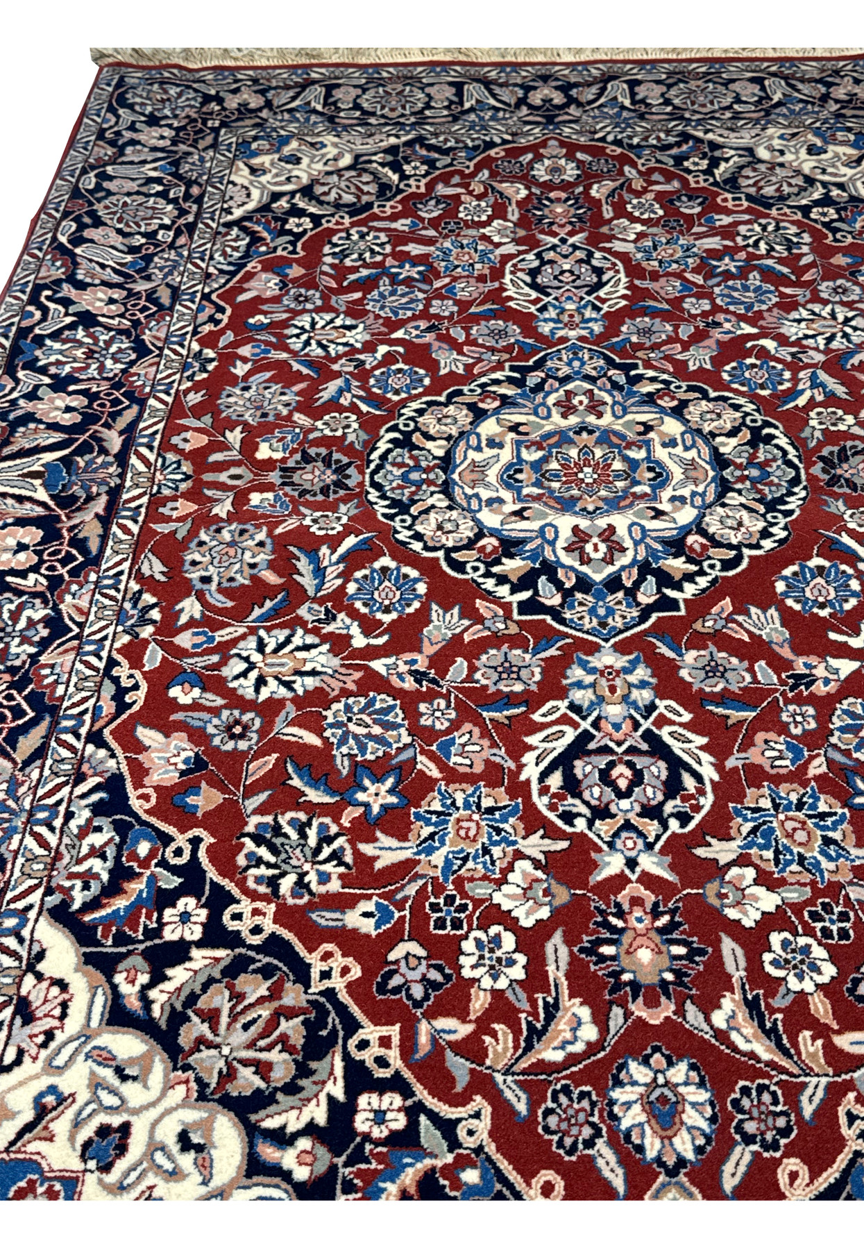 Angled perspective of Persian Isfahan rug emphasizing the texture and color variation