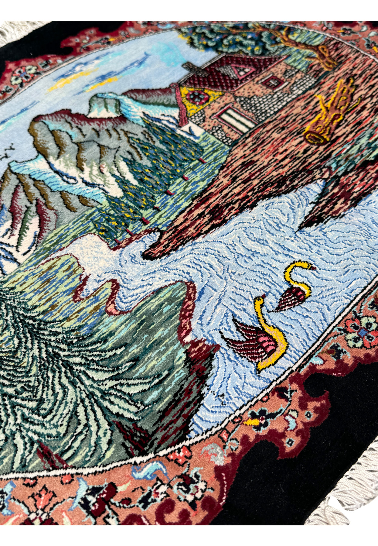 Intricate border design of a Persian Qum silk rug featuring floral motifs in crimson, beige, and indigo on a black background